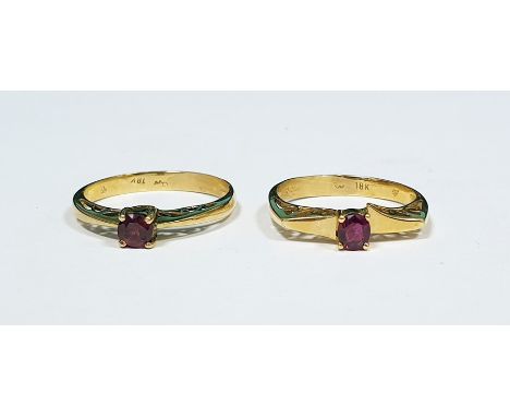 Two 18ct gold and ruby rings, each set single stone in pierced setting (2) Condition ReportThe weight of the rings (from phot