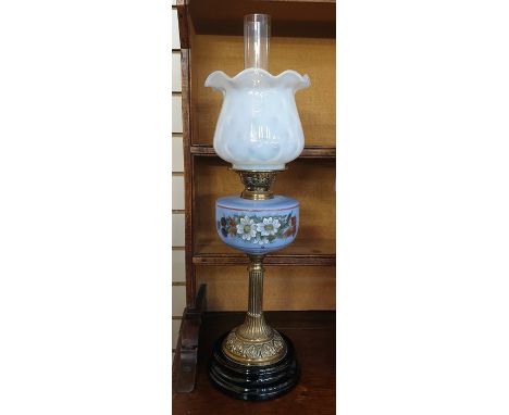 Victorian oil lamp with glass shade and pale blue opaque glass well painted with daisies, on a brass fluted column and a circ