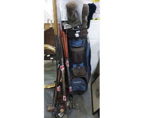 Golf caddy and assorted golf clubs 