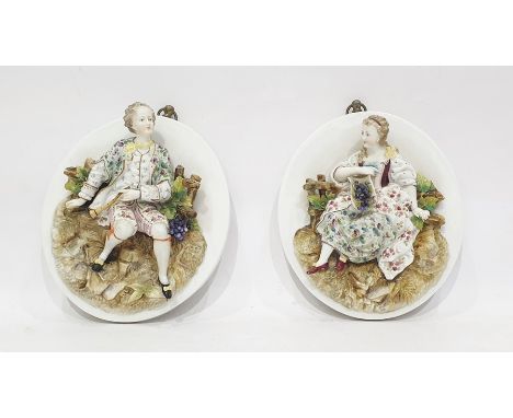 Pair (probably French)&nbsp;relief porcelain portrait plaques&nbsp;in the manner of Jacob Petit, Fontainebleau, each oval wit