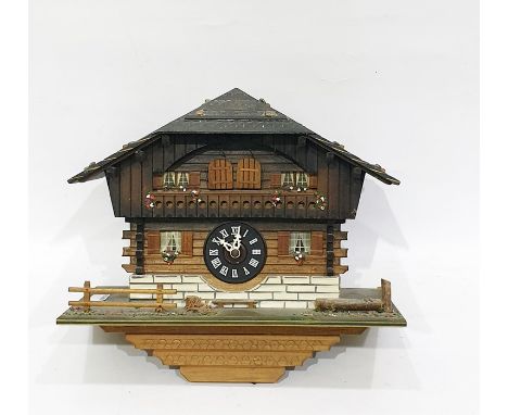 Swiss made three-train cuckoo and musical clock based on an alpine chalet 