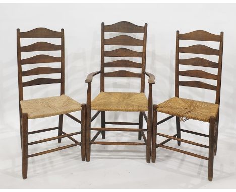 Set of eight (four carvers plus 4 chairs) oak ladder back chairs with rush seatsCondition Report4 of the chairs have damage t