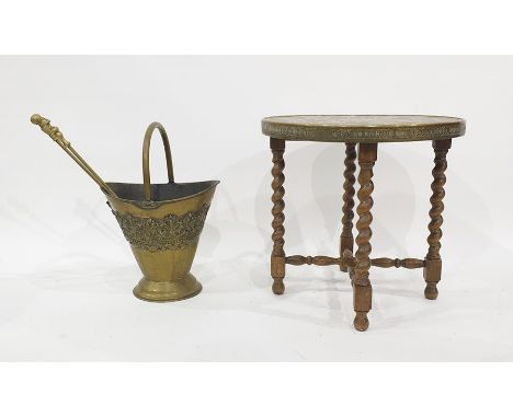 Circular brass topped coffee table on folding base with barley twist supports, brass coal bucket and fire tools