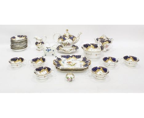 Early Victorian porcelain part tea and coffee service, probably Coalbrookdale of rococo style with blue and gilt borders, all
