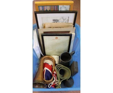 A mixed lot of military related items including a bugle, publications etc