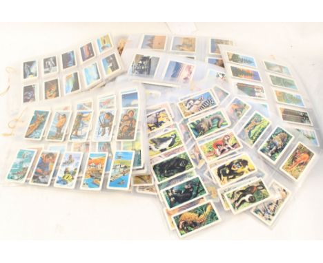 Various trade and cigarette cards in sleeves, Brooke Bond Canada, Esso Squelchers etc