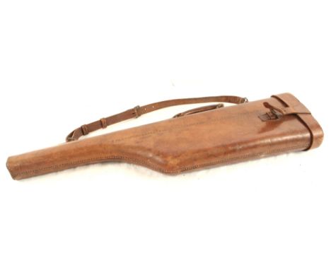 A vintage leather leg of mutton gun case, complete with carrying strap