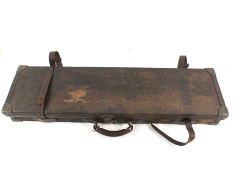 A canvas and leather trimmed gun case for 28" barrels shot gun, with trade label for Charles Lancaster, with a shooting stick