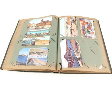 A postcard album to include mainly comic and greetings cards, noted 1 RP vintage motorcycle