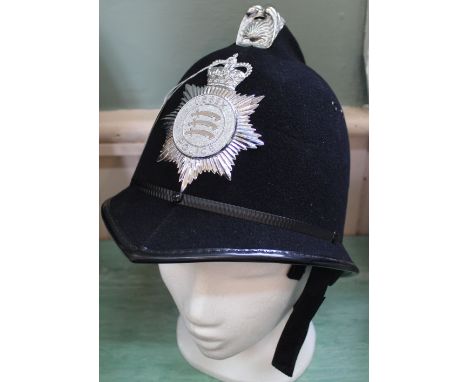 A Police helmet bearing Essex Police insignia plate
