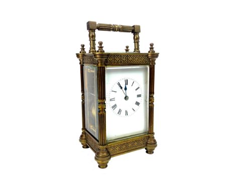 EARLY 20TH CENTURY BRASS REPEATER CARRIAGE CLOCK, with two train movement, the white enamel dial with Roman numerals, the bra