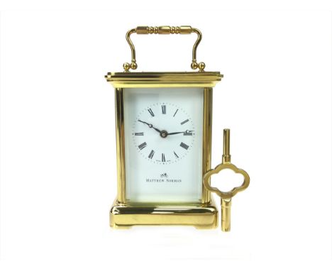 BRASS CARRIAGE CLOCK BY MATTHEW NORMAN, one train eight day movement, the white enamel dial with Roman numerals, contained in