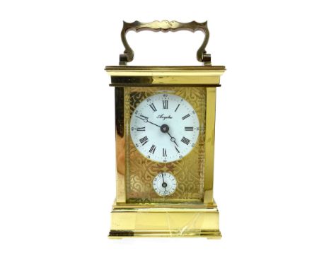 BRASS CARRIAGE CLOCK BY ANGELUS, two train eight day movement, the giltmetal face engrave with strapwork, the white enamel di
