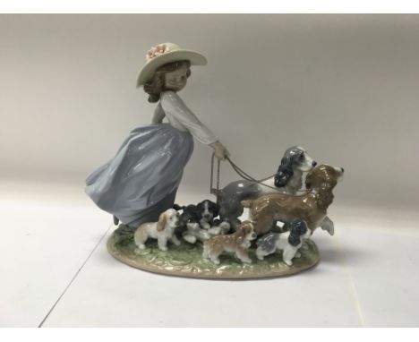 A Lladro figure No. 6784 titled “Puppy Parade”