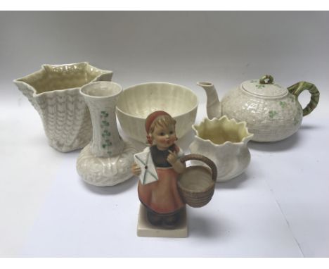 A collection of Belleek Ireland China along with a Goebel W. Germany figure of a young girl.