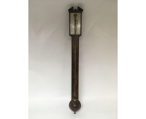 A mahogany stick barometer by Shuttleworth of London.