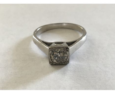 An 18 carat white gold ring set with a diamond approximately.55 carat. Ring size P.