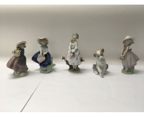 A collection of five Lladro figures to include No. 8352 “Walk through blossoms” and No. 5221 “Sweet scent”