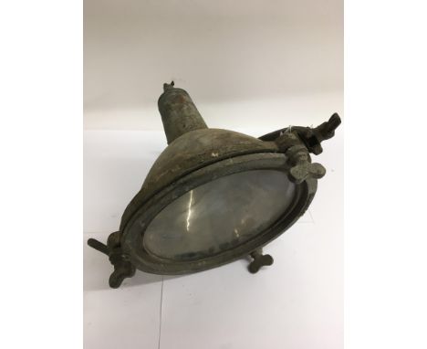 An old spot type light with clamp fitting