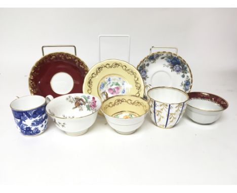 A box containing a quantity of mixed cups and saucers, including examples by Aynsley, Royal Albert and Royal Worcester.