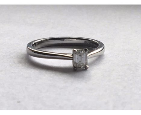 A Platinum ring set with a solitaire Emraldcarat weight .33 approximately.ring size N.