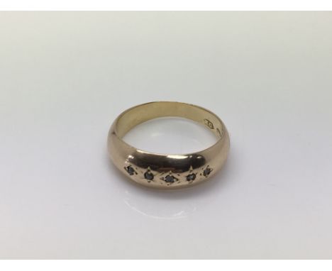 A gents 18ct gold ring set with diamond chips, approx 2g and approx size K.