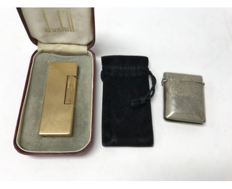A cased Dunhill lighter and a white metal Vesta case.