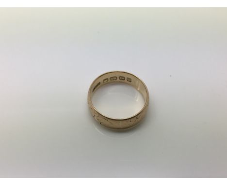 An 18ct gold wedding band, approx 3.6g and approx size K-L.