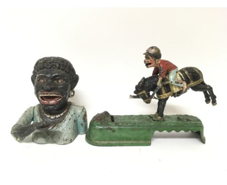 Two vintage cast iron money boxes, comprising of a bust labelled to the back Dinah and a jockey riding a horse.