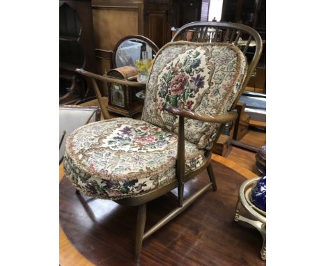 A dark wood Ercol low chair