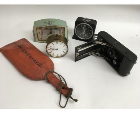 Three old clocks, a Kodak extending camera and an unusual paddle