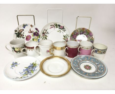 A box containing a quantity of mixed cups and saucers, including examples by Royal Doulton, Aynsley, Coalport, New Chelsea Po