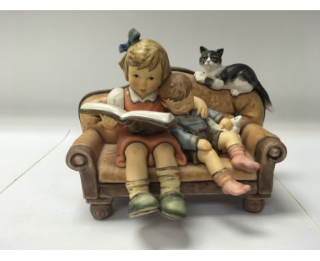 A Goebel of Germany figure titled "Story time" No. 2261. Marked as a limited edition being 958 out of 3000.