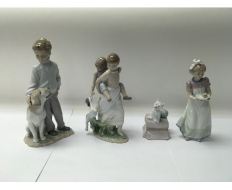 A collection of four Lladro figures to include No. 8353 “Oh happy days” and No. 6902 “my loyal friend”