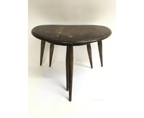 An Ercol nest of two small pebble tables. The tallest measures approximately 36cm tall x 49cm wide x 34cm deep.