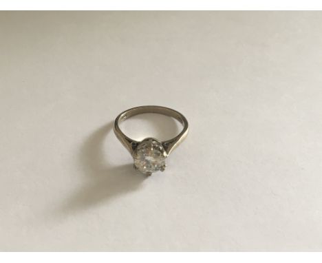 An 18 carat Gold ring set with a Moissanite solitaire. Ring size L.