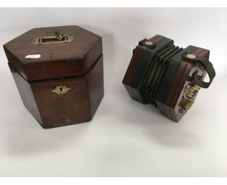 A fine antique forty button six sided concertina with inset label Rock Chidley Manufacturer 135 High Holborn London late fini