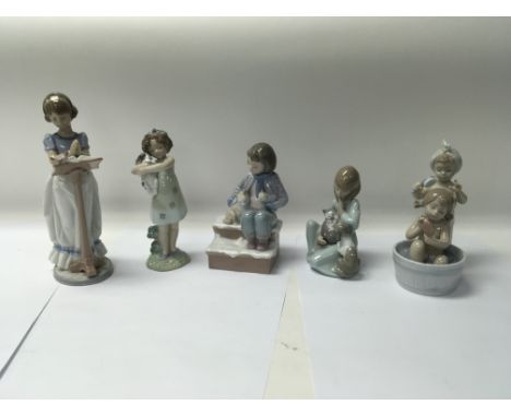 A collection of five Lladro figures to include No. 6584 “Sunday Prayer” and No. 6457 “Bathtime Beauties”