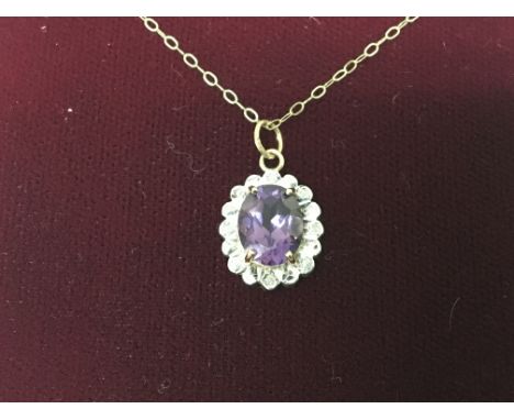 An Amethyst set pendent with small diamonds on a 9ct gold chain.