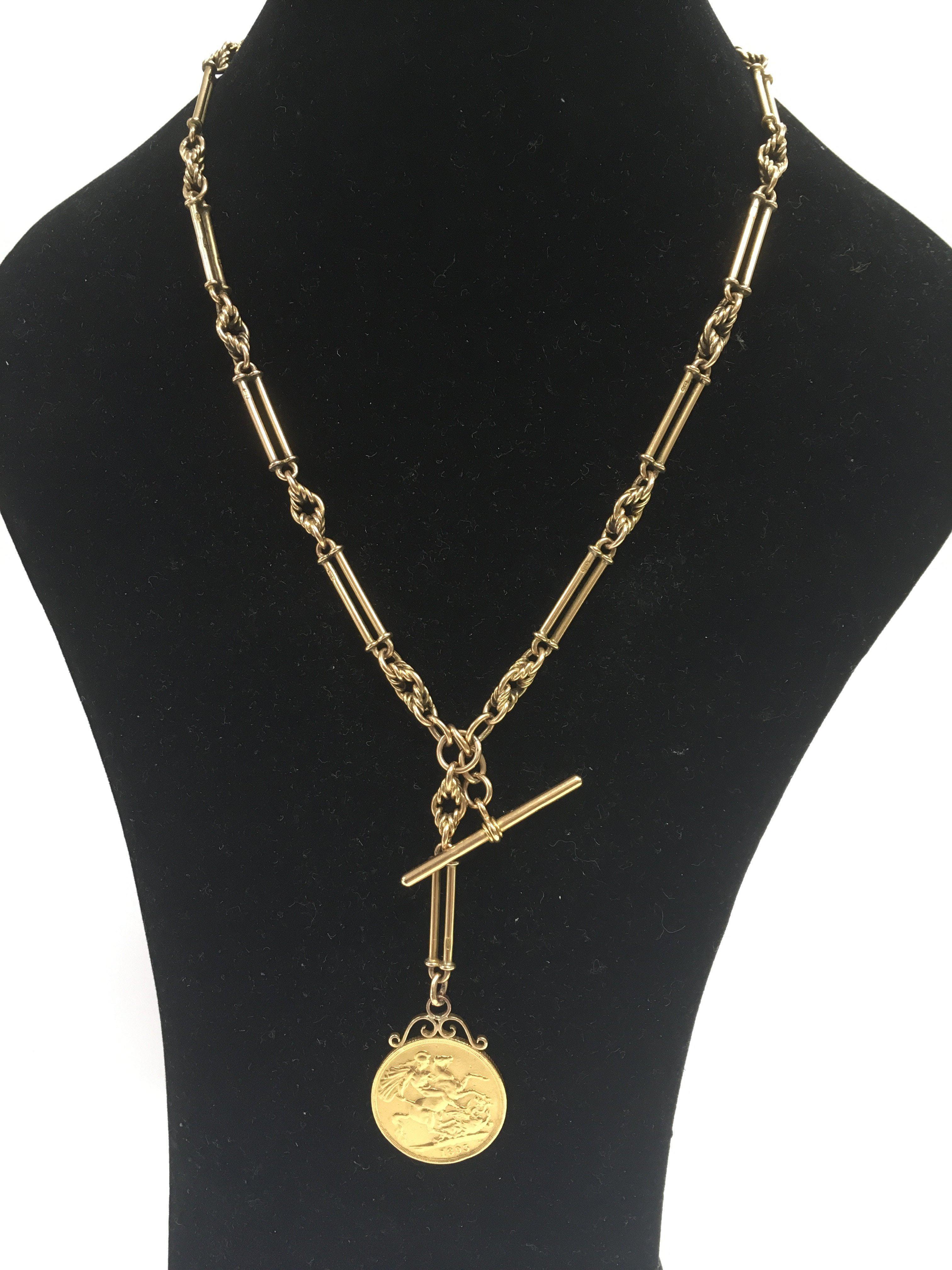 An 18ct gold chain with attached 1893 two pound coin.