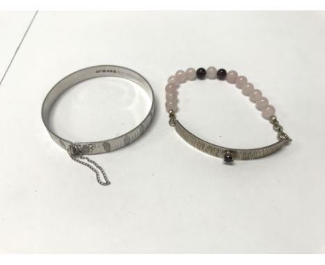 A quartz and garnet silver bracelet together with a silver 'Nymph' bangle. Weight approx 25g