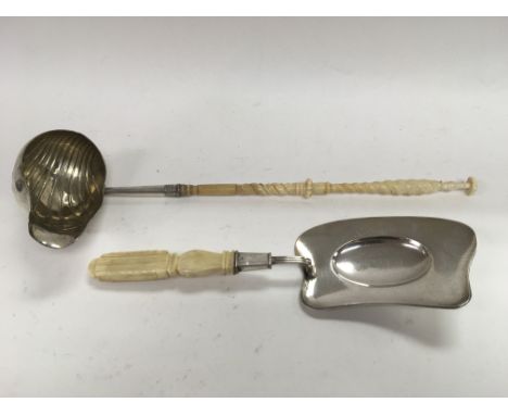 A silver toddy ladle and a crumb scoop (2).
