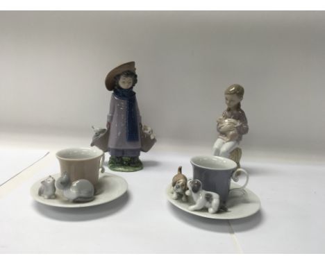 A collection of Lladro and anal items to include a Nao figure and two Lladro cups and saucers