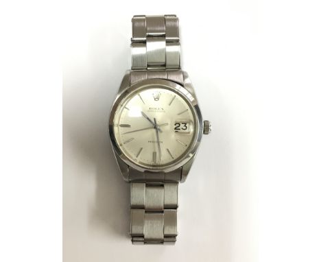 A gent's vintage Rolex Oysterdate watch with stainless steel dial and original strap.Model number 6694, serial number 1835608