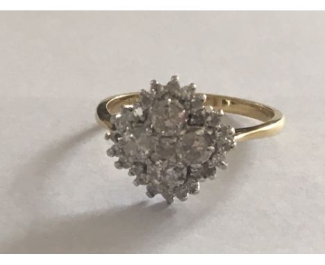 An 18 carat Gold ring set with a cluster of diamonds in excess of 1.25 total carat weight. Ring size S.