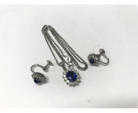 An 18ct white gold sapphire and diamond pendant together with matching earrings. Weight approx 9.5g