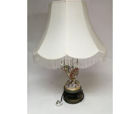 A modern continental ceramic table lamp with a white shade,