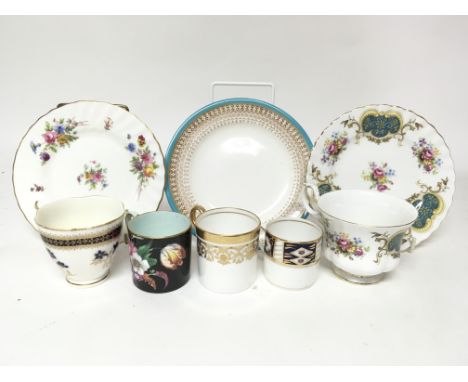 A box containing a quantity of mixed cups and saucers, including examples by Royal Worcester, Paragon and Aynsley.