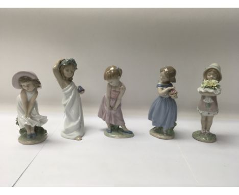 A collection of five Lladro figures to include No. 8313 “You des the best” and No. 8630 “Adorable Mary”