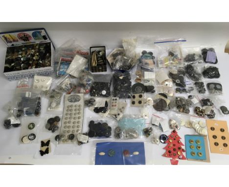A large collection of various vintage 20th century buttons including mother of pearl, jet and display samples
